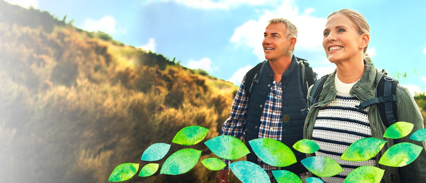 mature man and woman smiling outdoors