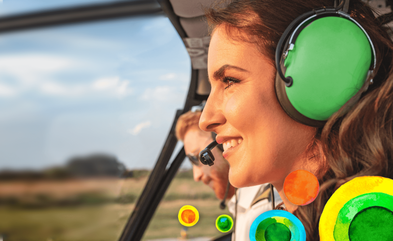 woman smiling in a helicopter